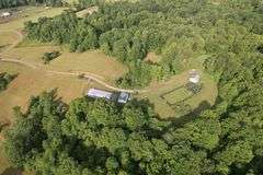 41.97 +/- acres surface with 79.85 +/- acres oil and gas rights, modern farmhouse