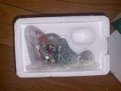 Department 56/Heritage Village “Holiday Travelers” and “A Christmas Beginning”