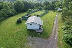 41.97 +/- acres surface with 79.85 +/- acres oil and gas rights, modern farmhouse