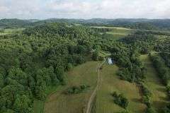 41.97 +/- acres surface with 79.85 +/- acres oil and gas rights, modern farmhouse