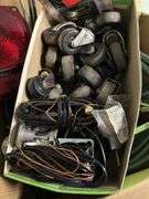ASSORTMENT BOX WITH TAIL/BRAKE LIGHT, WIRING, GLASS SQUEEGEES, CASTERS, RADIO ANTENNA AND MORE