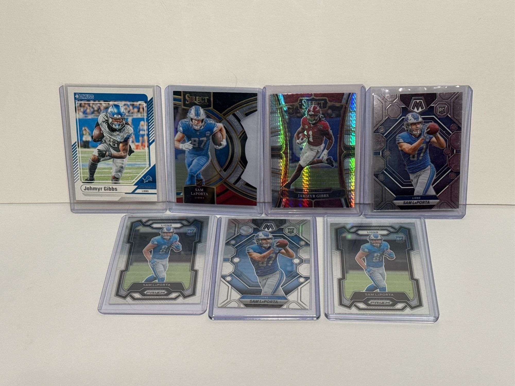 2023 Panini Select Jahmyr Gibbs RC, (2) 2023 Panini Prizm Sam LaPorta RC, (2) 2023 Panini Mosaic Sam