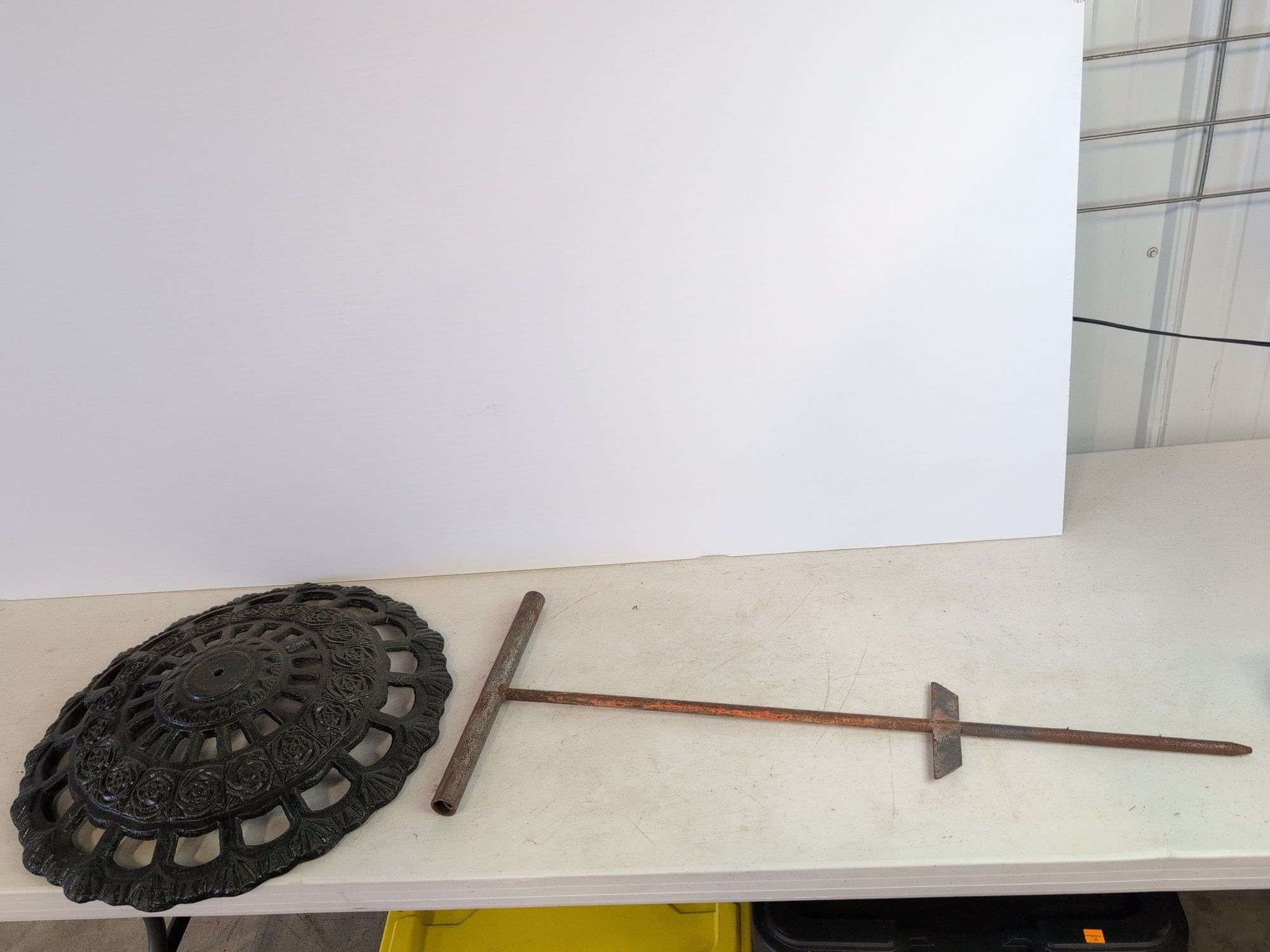 Large cast iron decorative piece and t-handled tool