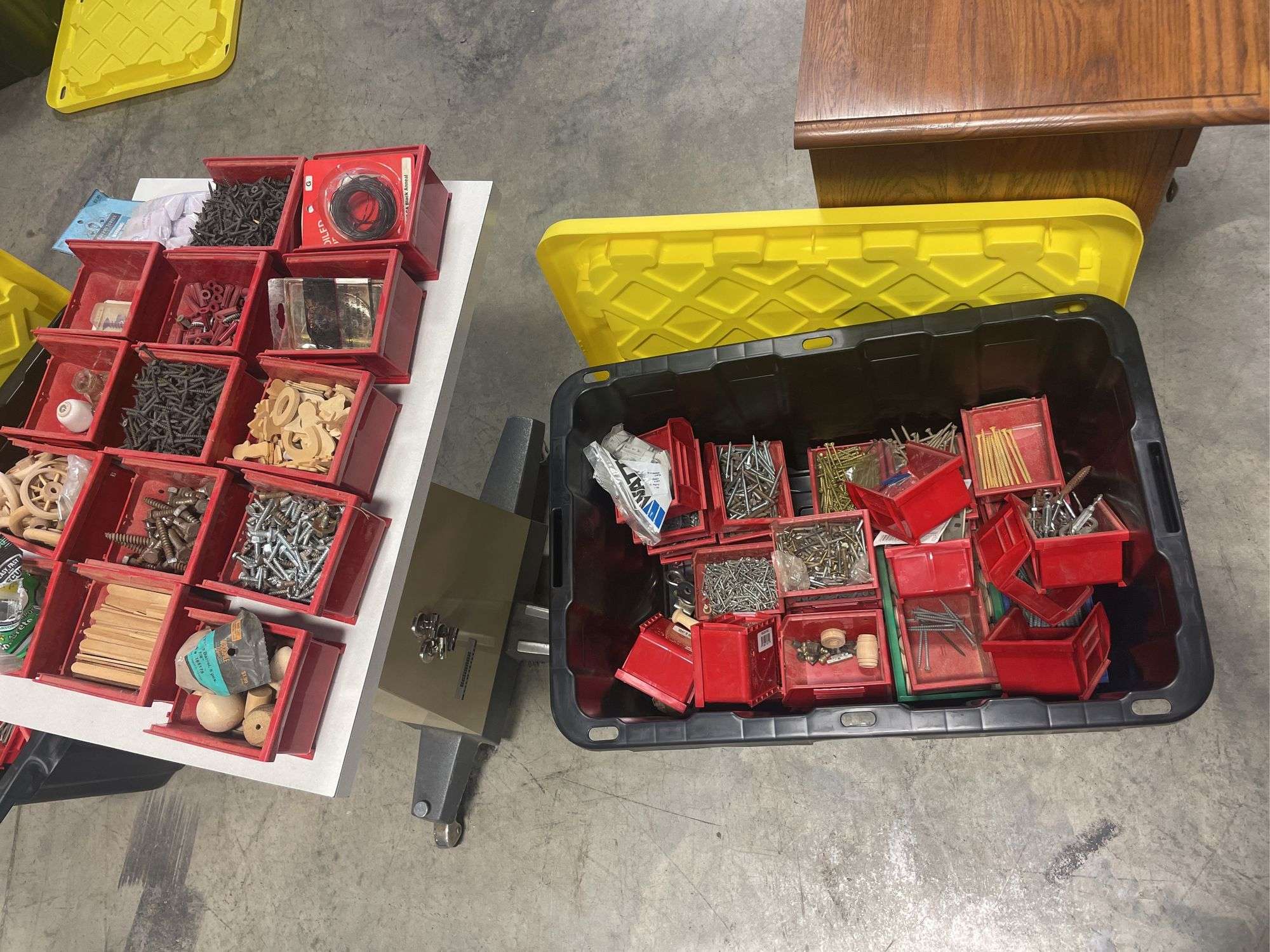 Tote of screws, woodworking supplies, and hardware