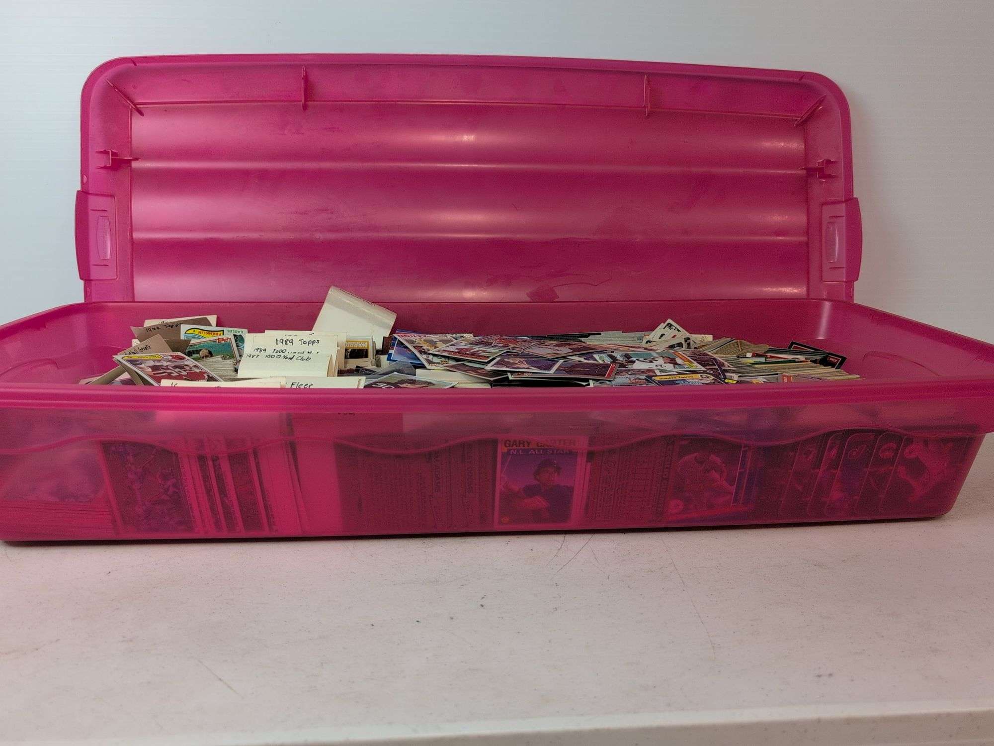 Tote full of 80s and 90s baseball, football, and basketball cards