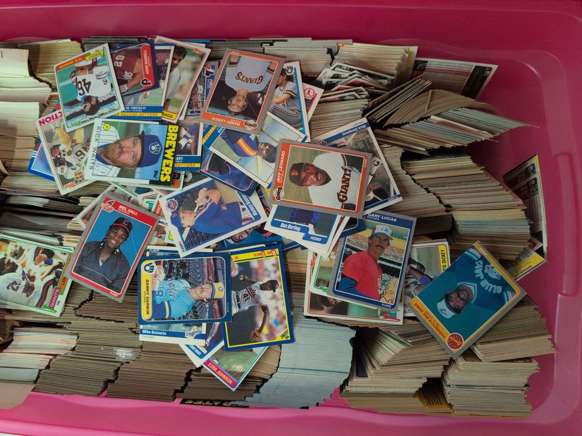 Tote full of 80s and 90s baseball, football, and basketball cards
