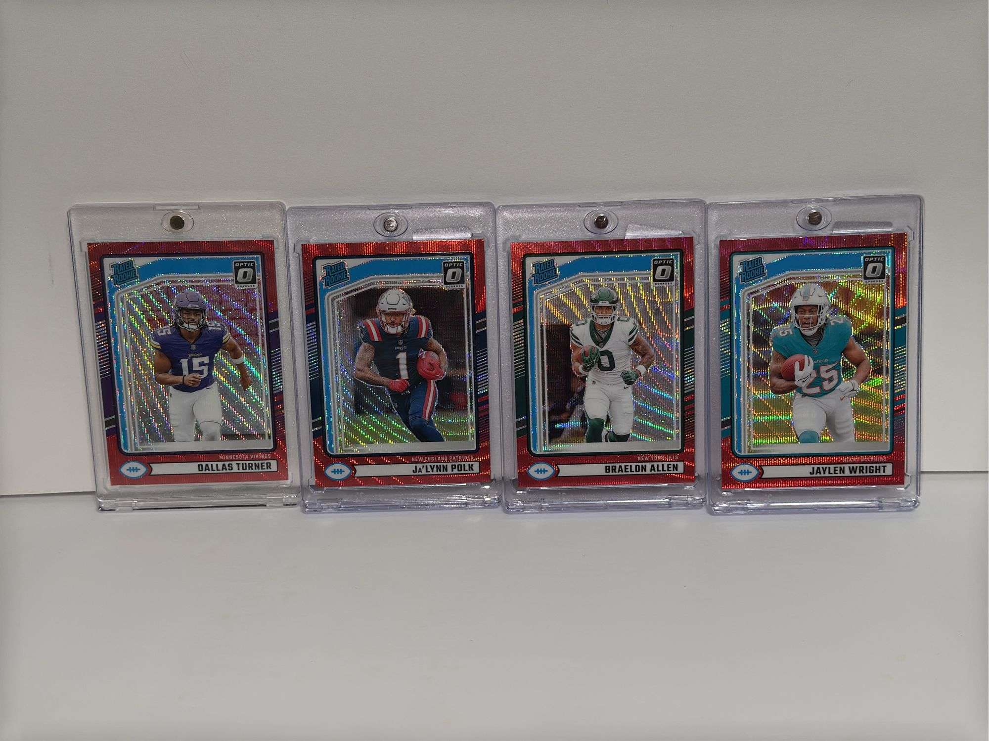 (4) 2024 Donruss Optic Rated Rookie Red Wave Short Print Parallel RC’s of Dallas Turner, Jaylen Wrig