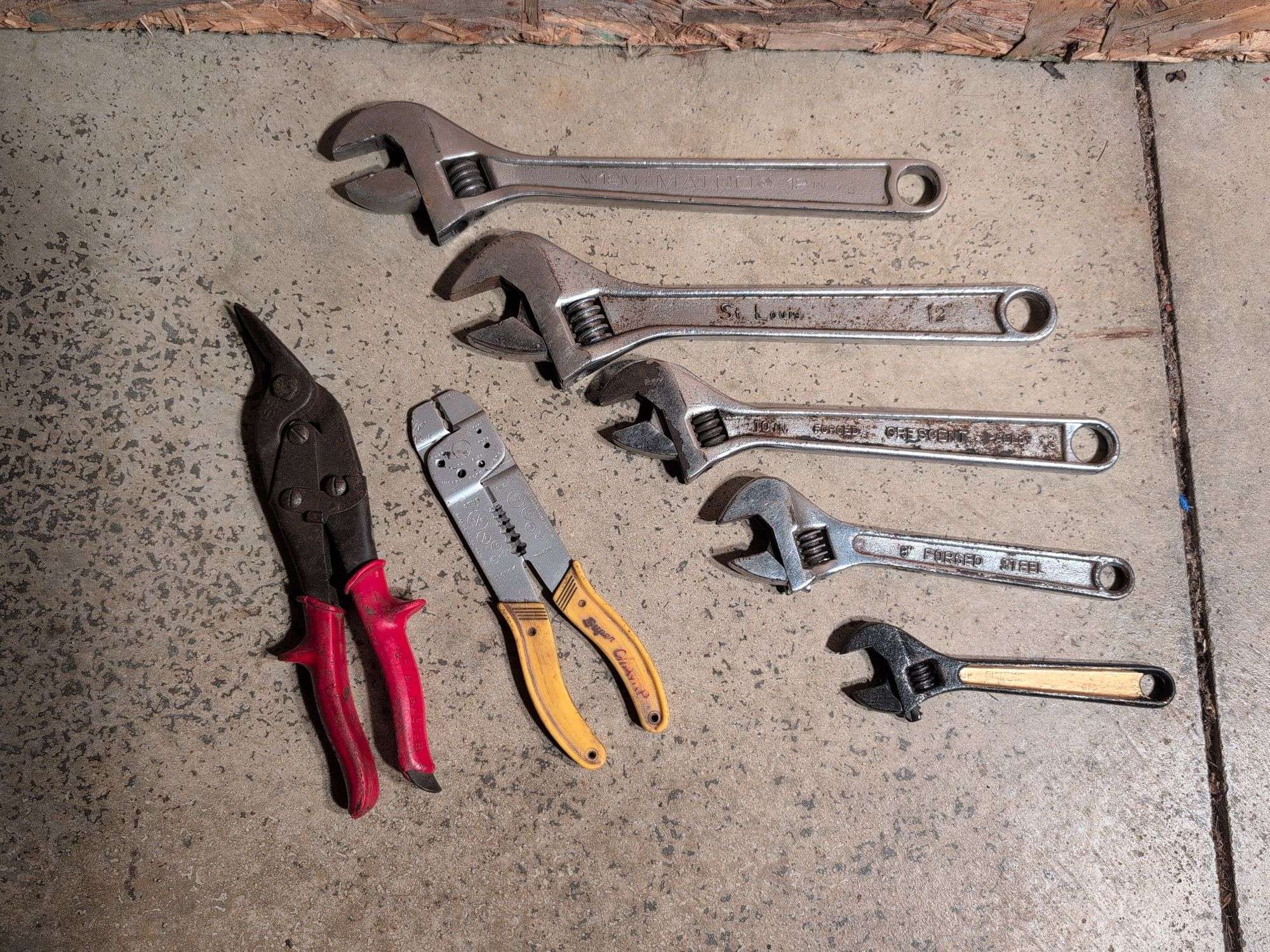 (5) adjustable wrenches, wire stripper, and metal snips
