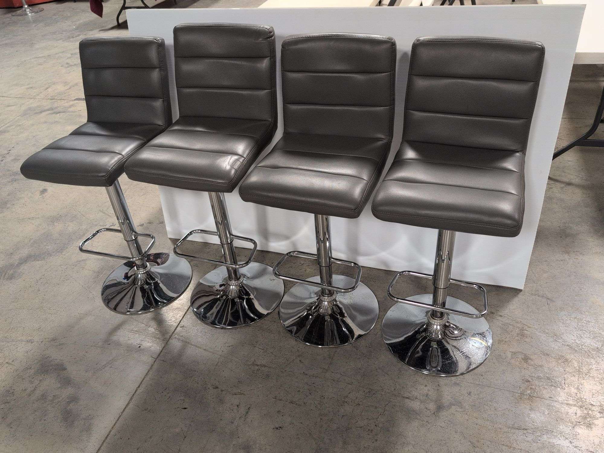 (4) matching grey leather swivel adjustable bar stools