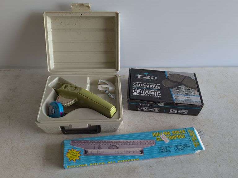 Dymo label maker kit, rolling ruler, and ceramic disc brake pads