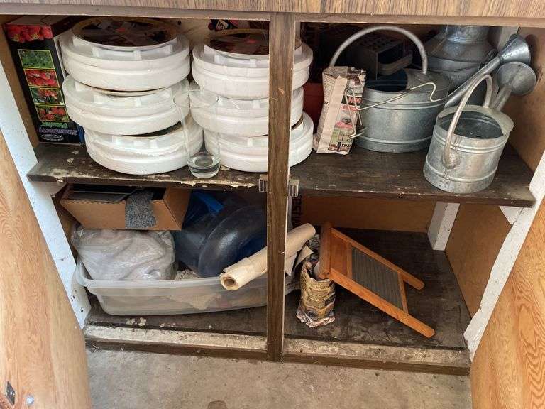 CONTENTS INCLUDING HUMMEL DECOR PLATES, VINTAGE WATERING CANS AND MORE