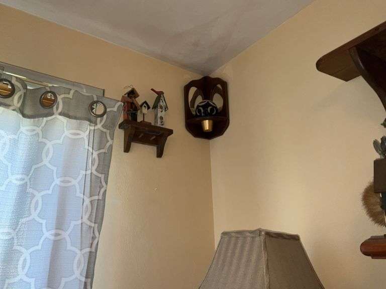 WOODEN SHELVES AND RUSTIC DECOR ON WALL