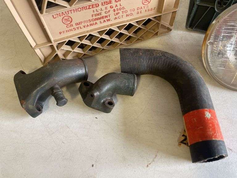 Vintage headlights and exhaust manifolds and pipes