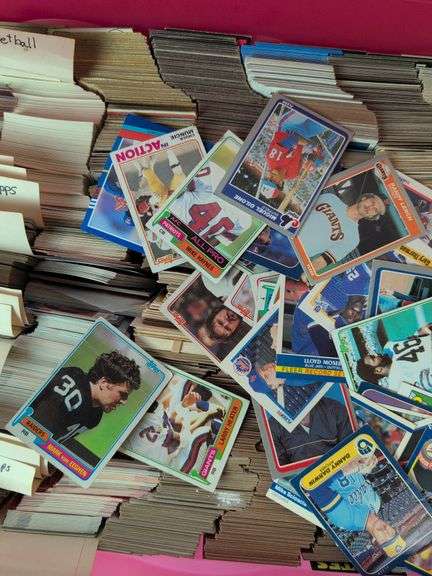 Tote full of 80s and 90s baseball, football, and basketball cards