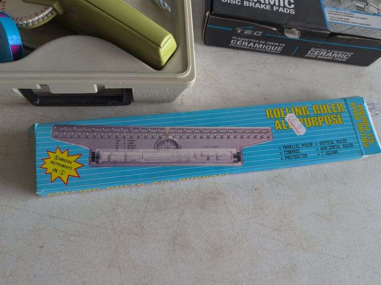 Dymo label maker kit, rolling ruler, and ceramic disc brake pads