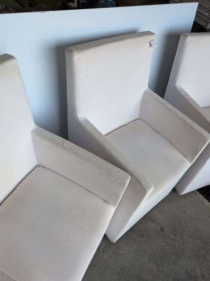 (4) matching white chairs on wheels