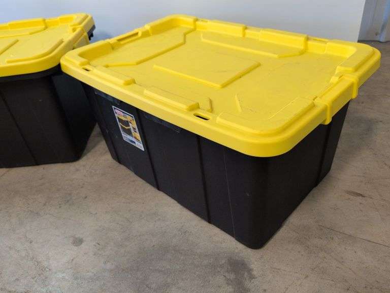 (2) black Sterilite industrial storage containers with yellow lids and handles