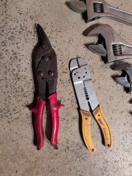 (5) adjustable wrenches, wire stripper, and metal snips