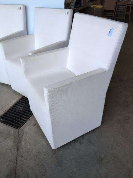 (4) matching white chairs on wheels