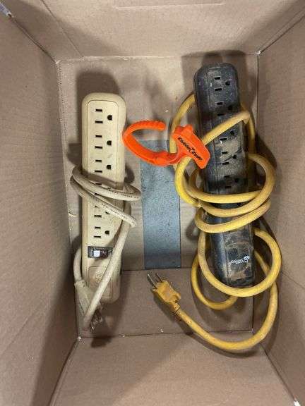 Box of extension cords and power strips