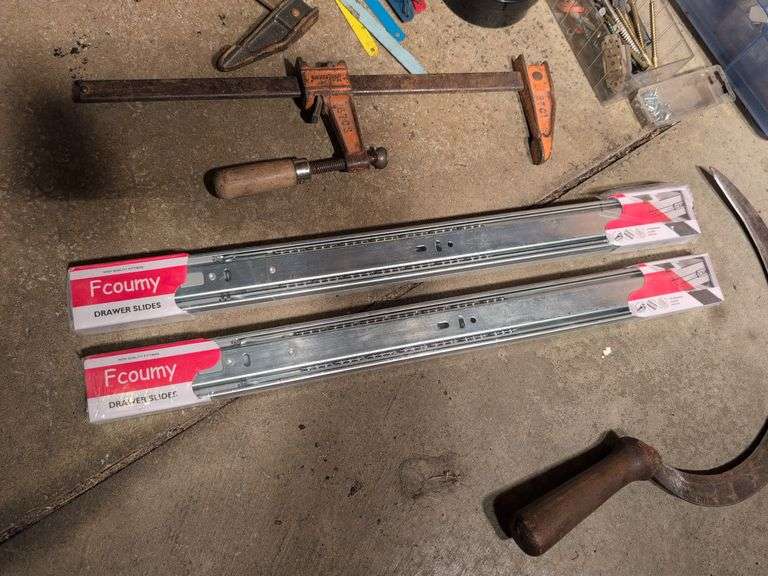 Miscellaneous tools and hardware - gas can, clamps, scythe, railroad nails, hacksaw blades, and more