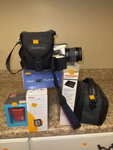 Assortment of Cameras, DVD Player and Speaker - Kaufman Realty & Auctions