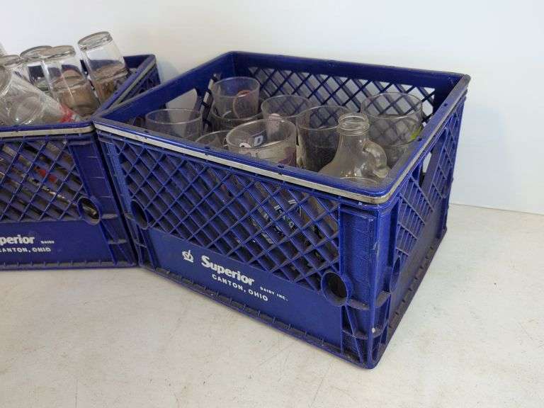 Bar glasses with sports logos in (2) milk crates
