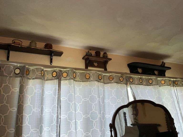 WOODEN SHELVES AND RUSTIC DECOR ON WALL