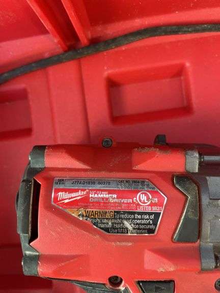 Milwaukee pack out and tool box with drill, impact, battery and charger
