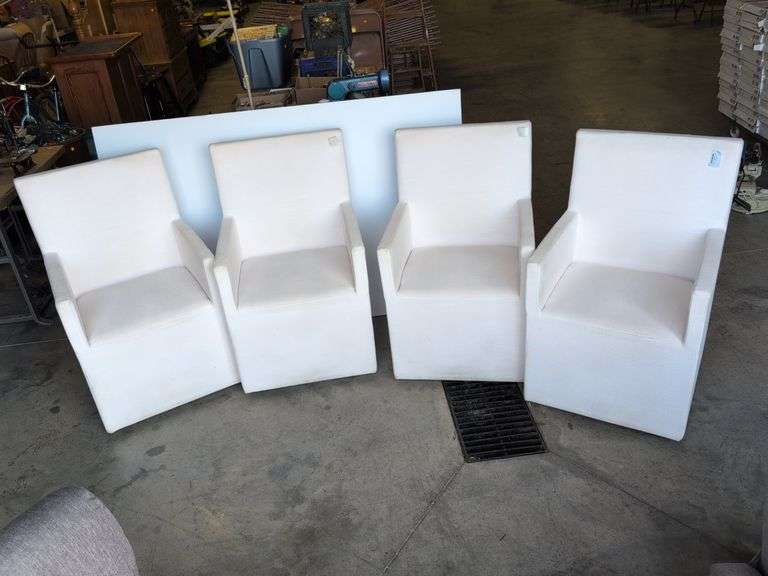(4) matching white chairs on wheels