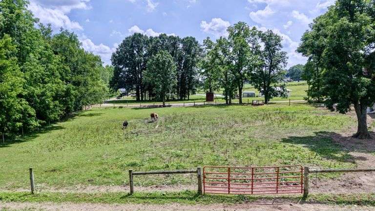 Parcel 1: 9.4 Acres with Farmstead, Pond and Cabin.