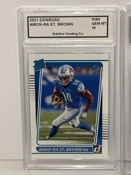 2021 Donruss Rated Rooke Amon-Ra St. Brown (SGC 10) and 2023 Select Sam LaPorta Concourse Rookie (GM