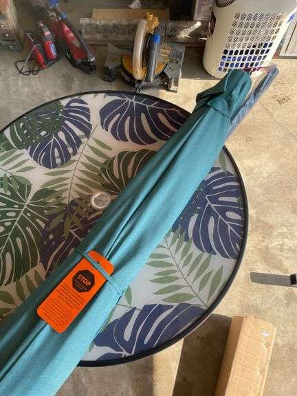 OUTDOOR GLASS TOP TABLE AND UMBRELLA