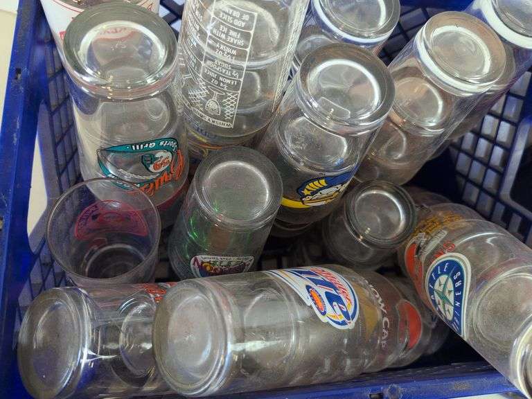 Bar glasses with sports logos in (2) milk crates