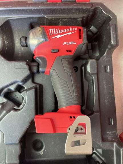 Milwaukee pack out and tool box with drill, impact, battery and charger