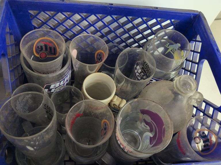 Bar glasses with sports logos in (2) milk crates