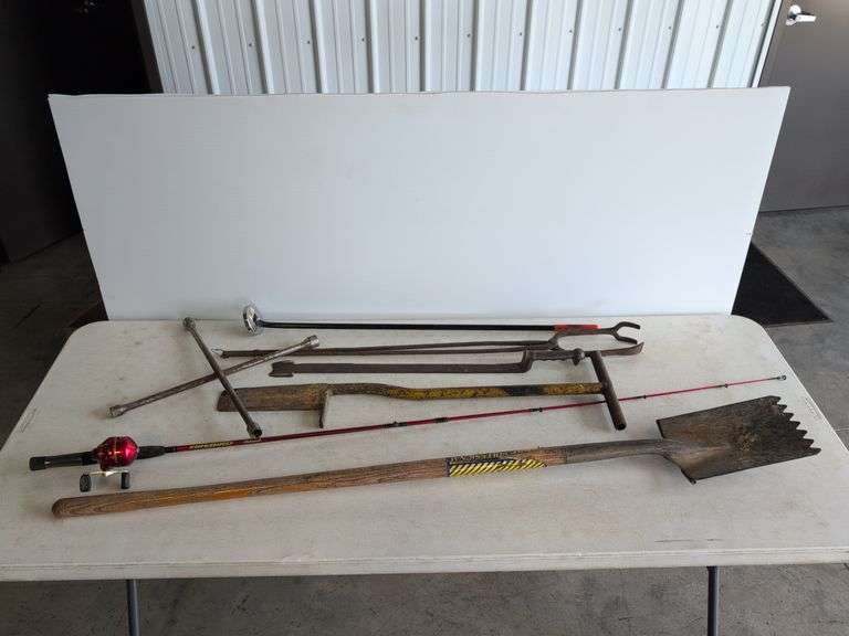 Firebird fishing rod, roofing shovel, tire iron, magnet, and other tools