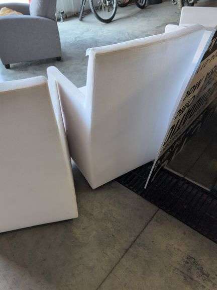(4) matching white chairs on wheels