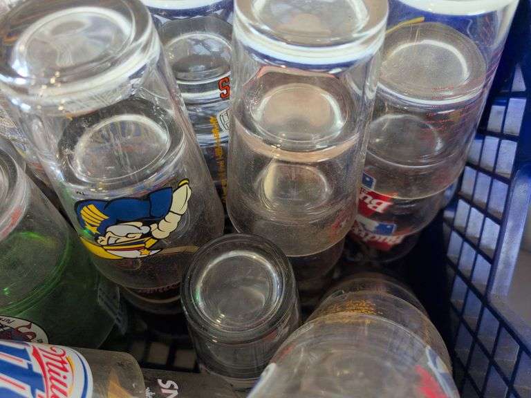 Bar glasses with sports logos in (2) milk crates
