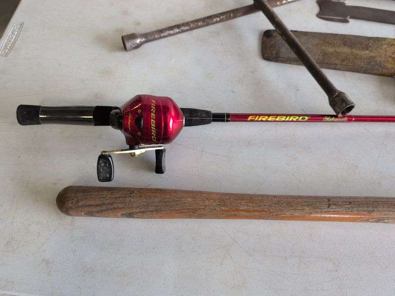 Firebird fishing rod, roofing shovel, tire iron, magnet, and other tools