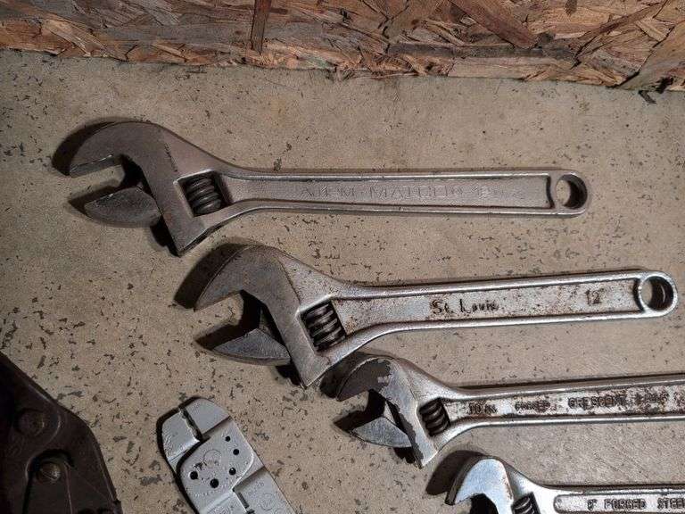 (5) adjustable wrenches, wire stripper, and metal snips