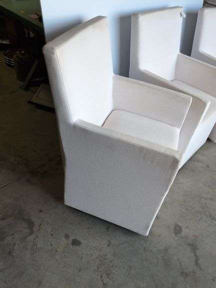 (4) matching white chairs on wheels