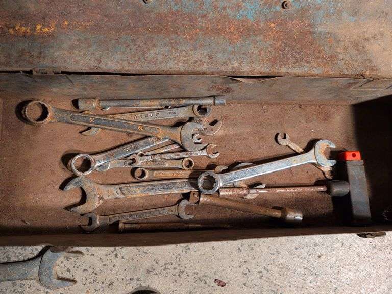 Metal toolboxes with wrenches and sockets
