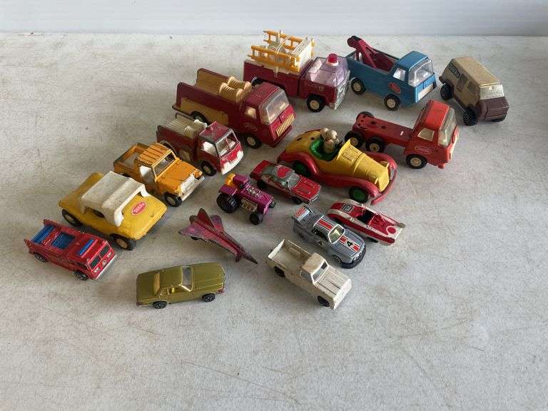 Flat of mostly Tonka toy cars and trucks