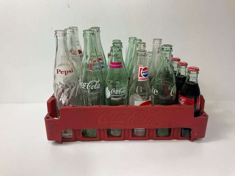 Assortment of Coca Cola and Pepsi Bottles