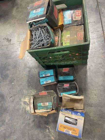 Milk crate full of miscellaneous nails