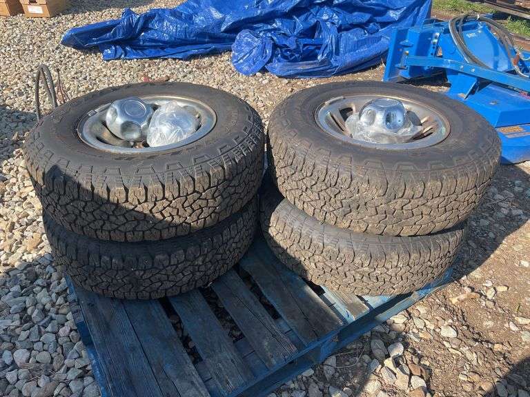 (4) Goodyear wrangler tires w/ hubs