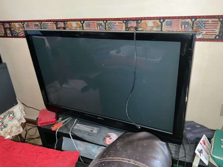 TV W/STAND, CABINET AND ALL CONTENTS