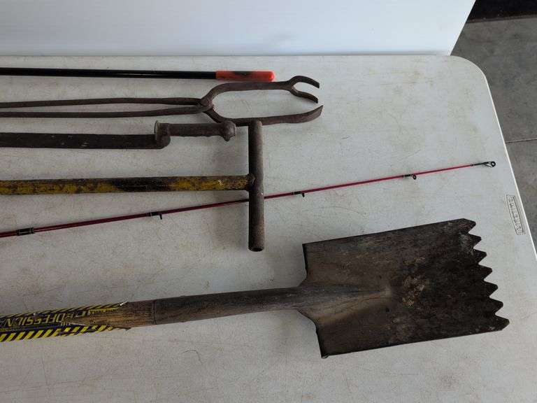 Firebird fishing rod, roofing shovel, tire iron, magnet, and other tools