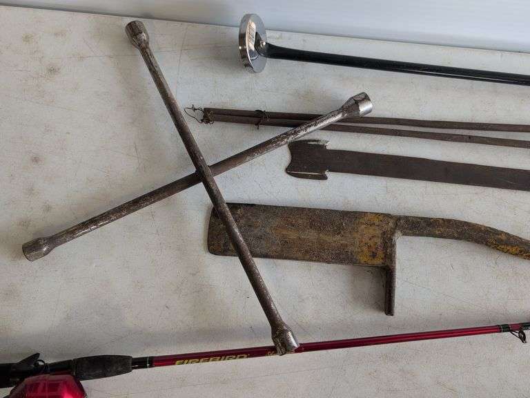 Firebird fishing rod, roofing shovel, tire iron, magnet, and other tools